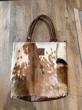 Cowhide Tote Bag with Key Charm in Brown and White